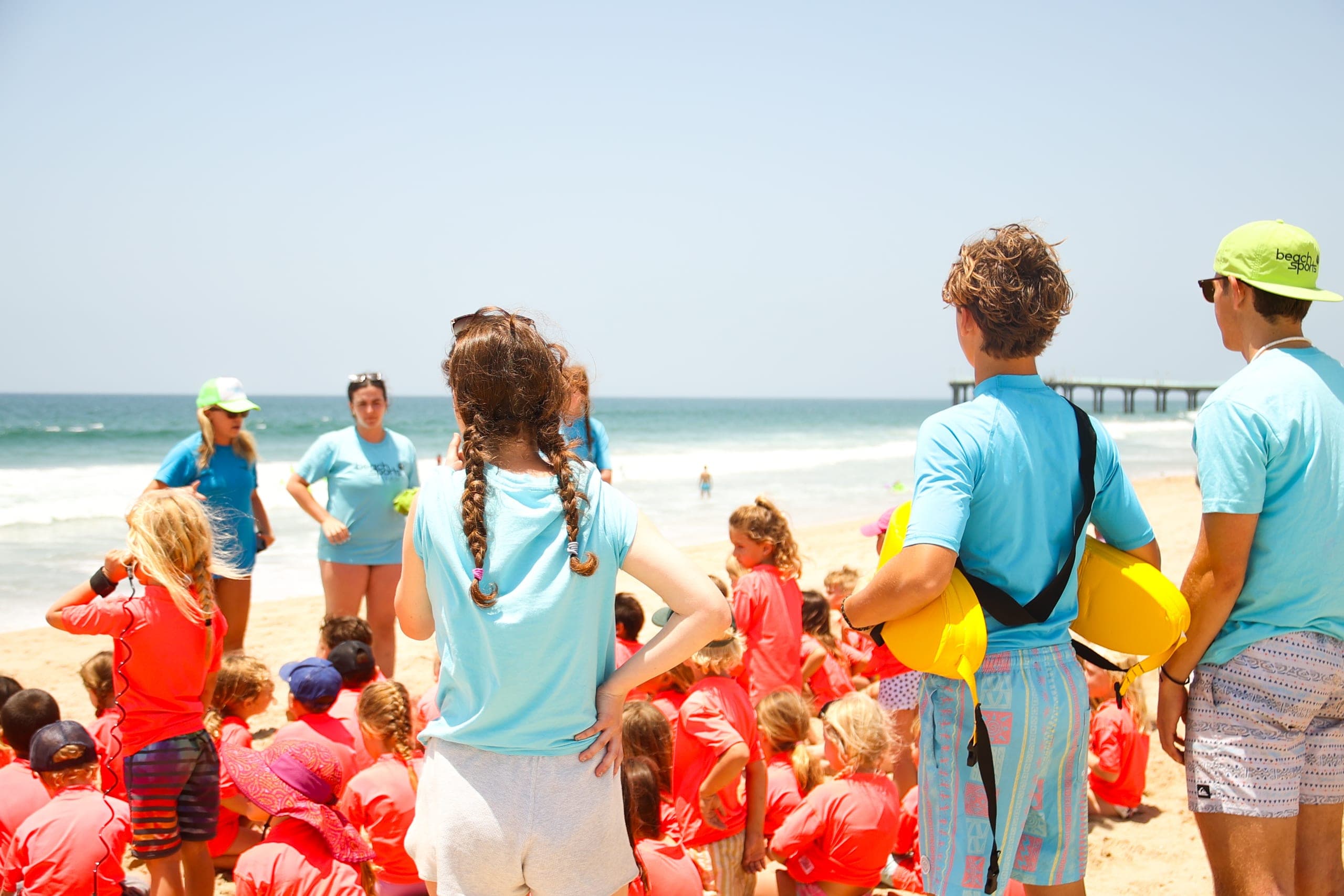 The BeachSports beach camp coaching crew on the sand