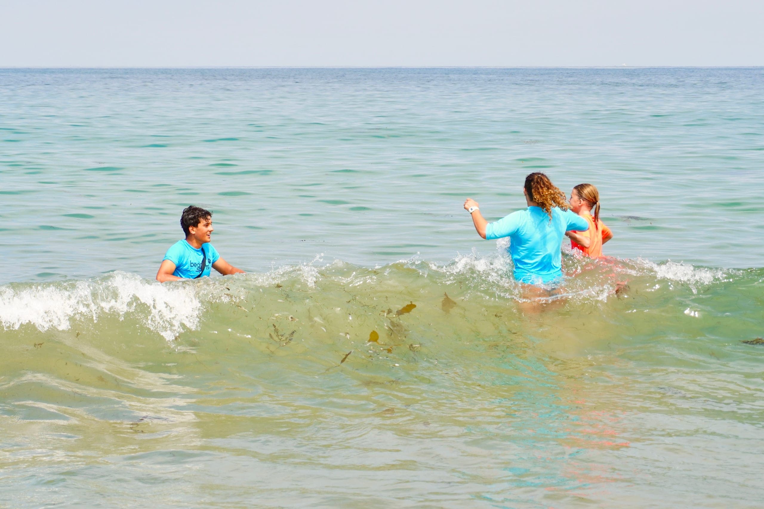 Ocean Program campers celebrating in the water