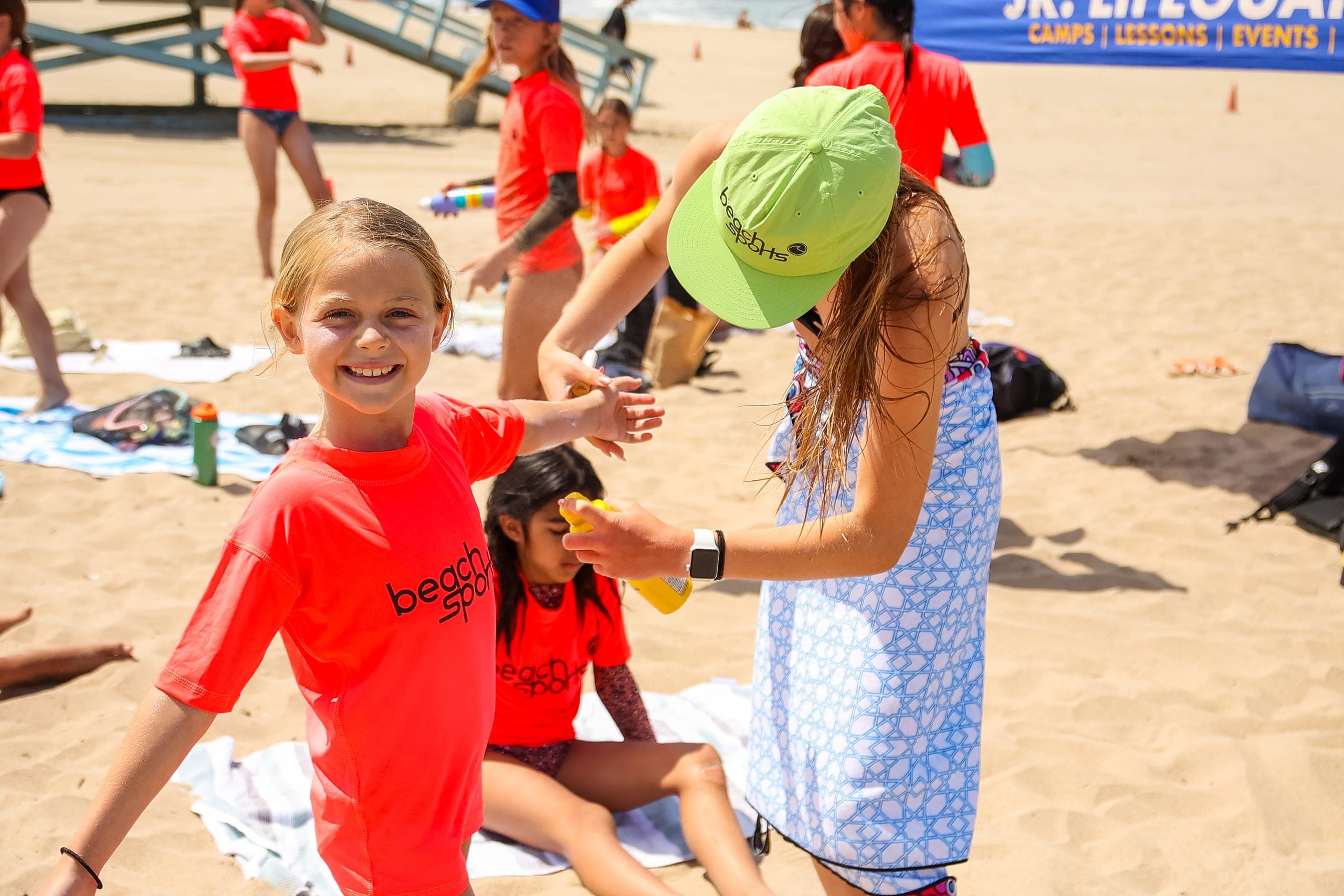 A coach-in-training helping campers